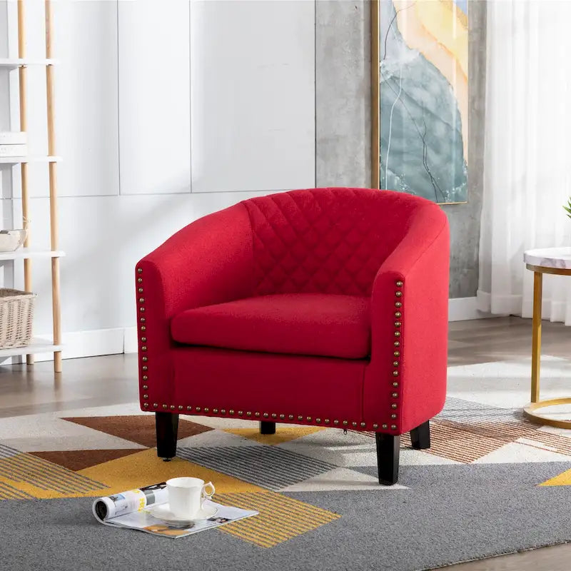 Poltrona a barilotto Accent, sedia da salotto con borchie e gambe in legno massiccio